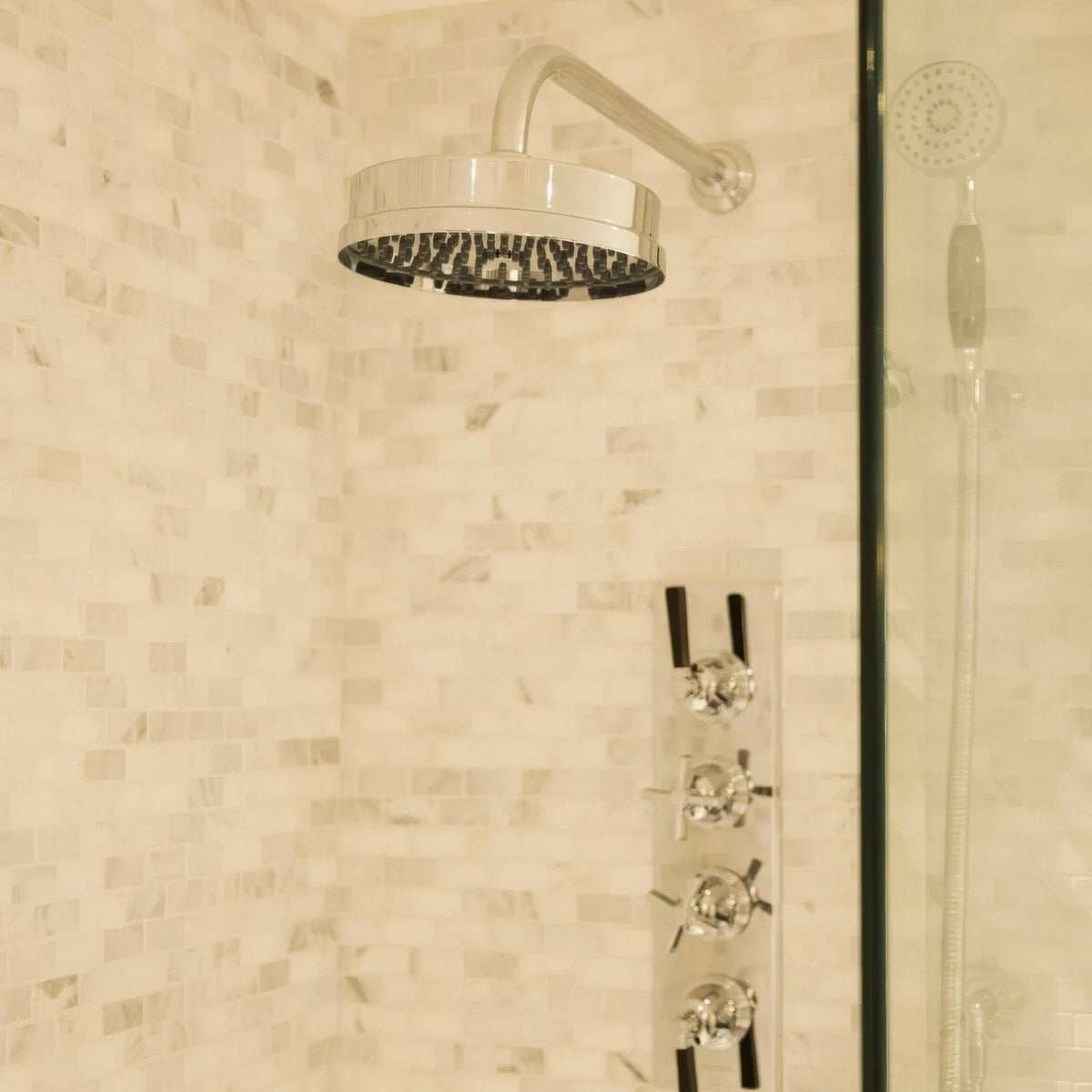 East Hampton Brick Marble Mosaic white marble brick mosaic with a chrome circular showerhead