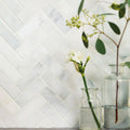 White marble east hampton harbour view herringbone mosaic tile backsplash with a classic pattern and polished finish
