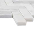 White marble mosaic tile with subtle veining arranged in a herringbone layout east hampton harbour view design