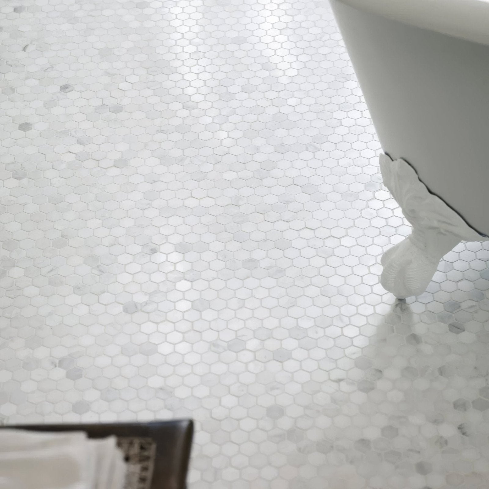 White hexagonal marble mosaic tile floor featuring east hampton hexagon marble mosaic design
