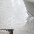 White hexagonal marble mosaic tile floor featuring east hampton hexagon marble mosaic design