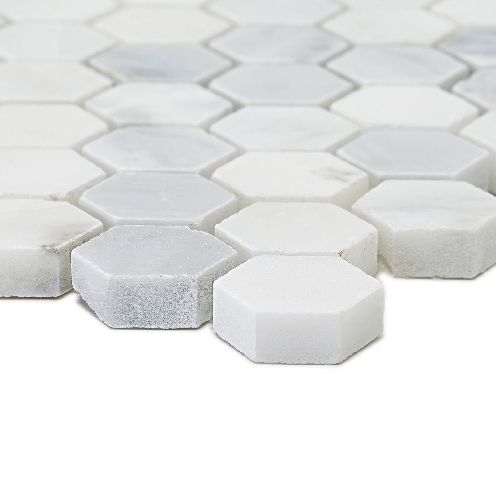 East hampton hexagon marble mosaic featuring white hexagonal tiles with subtle gray veining in marble material