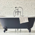 East Hampton Hexagon Marble Mosaic white marble hexagon mosaic with a dark grey clawfoot bathtub