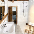 East Hampton Large Hexagon Marble Mosaic white marble hexagon mosaic beside a white sink with chrome taps