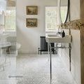 East Hampton Large Hexagon Marble Mosaic white marble hexagon mosaic above a white pedestal sink and black radiator