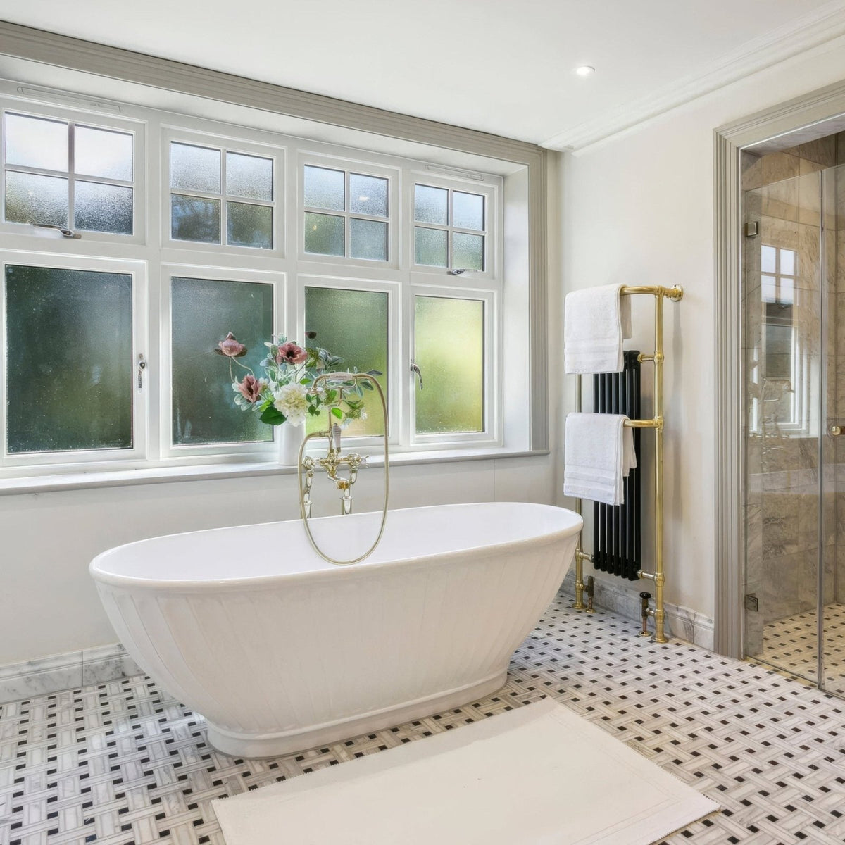 East Hampton Lattice Marble Mosaic white and black marble lattice mosaic with a white freestanding bathtub