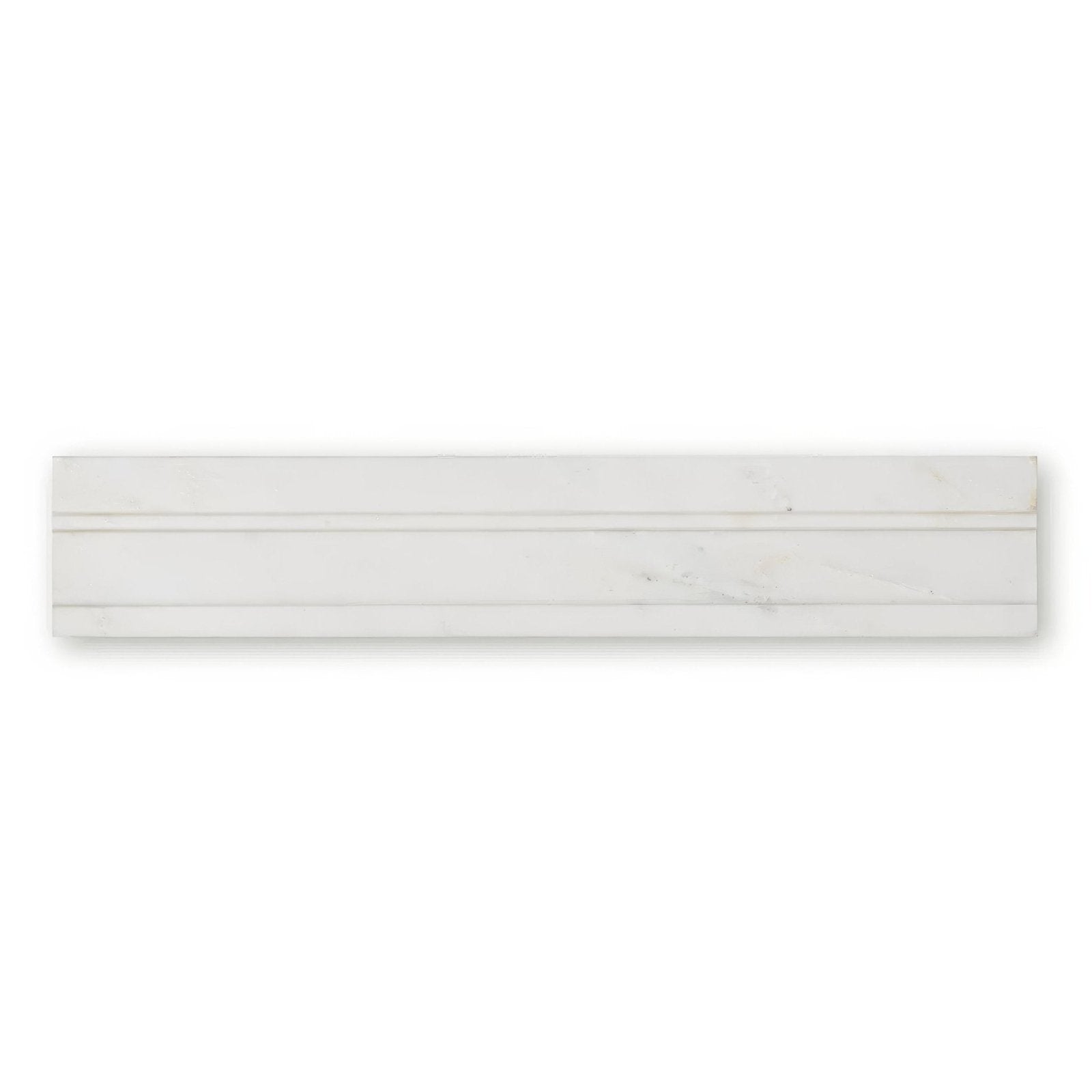 White marble subway tile with subtle veining and sleek modern design from East Hampton Marble Deco Dado collection