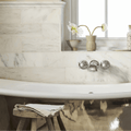 East Hampton Marble Tile 10x30cm white marble tiles with a marble bathtub and chrome fixtures