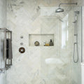 East Hampton Marble Tile 10x30cm white marble tiles with a chrome showerhead