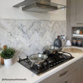 East Hampton Marble Tile 10x30cm white marble tiles with frying pans on a gas stove