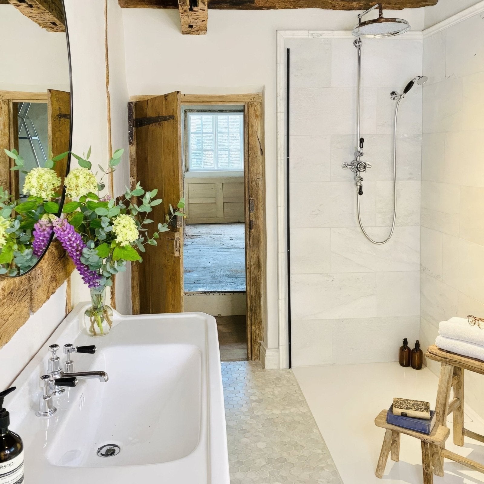 East Hampton Marble Tile 30x60cm white marble tiles with a double sink and chrome taps
