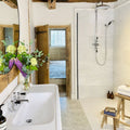 East Hampton Marble Tile 30x60cm white marble tiles with a double sink and chrome taps