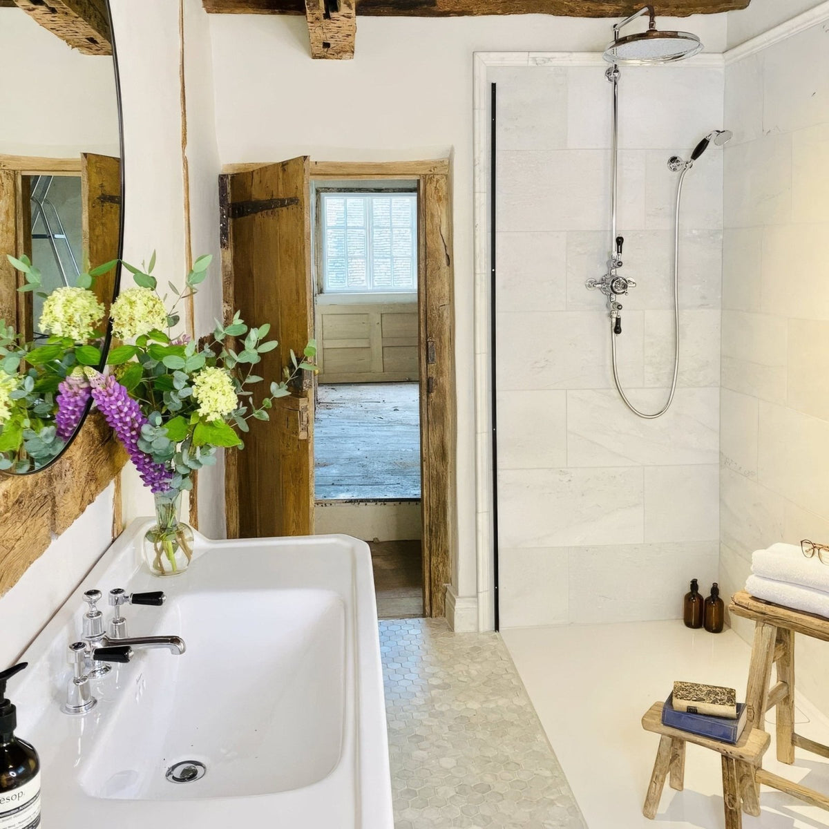 East Hampton Marble Tile 30x60cm white marble tiles with a double sink and chrome taps