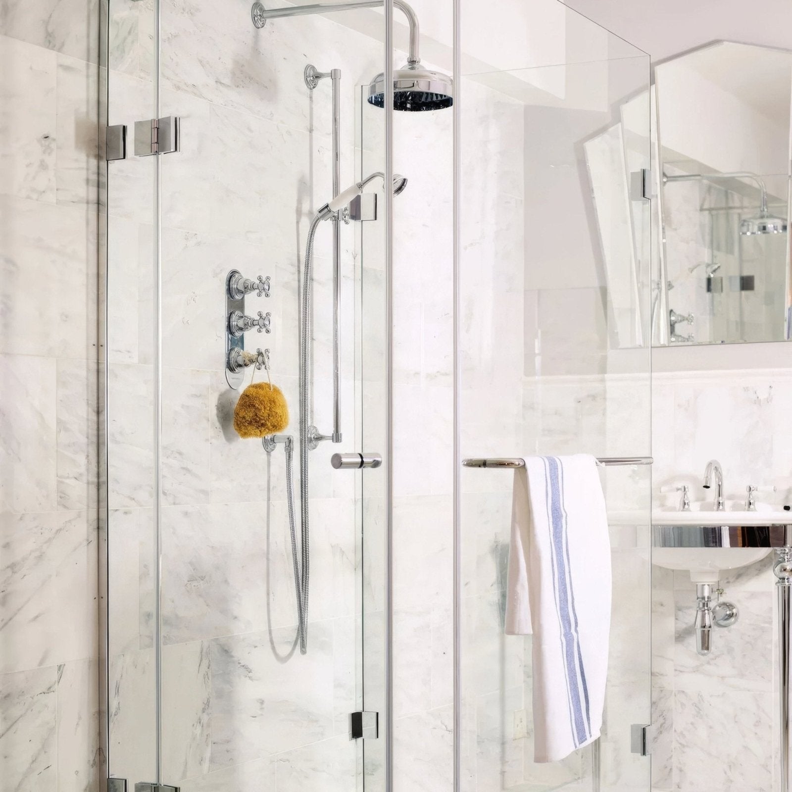East hampton marble tile 30x60cm with chrome finished showerhead featuring a sleek rounded design and black interior