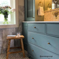 East Hampton Scallop Marble Mosaic white marble scallop mosaic with a blue vanity and gold knobs