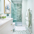 East Java Hummingbird Marble Honed Brick green marble honed brick tiles in a glass shower enclosure