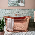East Java Hummingbird Marble Plume Mosaic light green marble fish-scale mosaic with a copper bathtub and striped towel