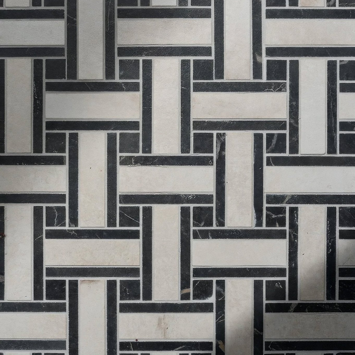 East Village porcelain basketweave mosaic Bianco featuring black and white marble geometric woven pattern tile