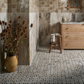 East Village Porcelain Basketweave Mosaic Oro beige and grey marble porcelain basketweave mosaic with a rustic vase of dried thistles