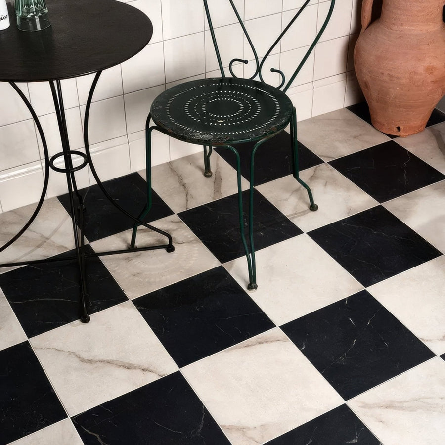 East Village Porcelain Bianco 60 x 60cm white marble-effect porcelain flooring with a dark green metal chair