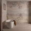 White freestanding bathtub with a brown towel beside eastern mist mural decorative 24-tile set panel