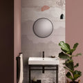 Round black-framed mirror featured in the eastern mist decorative 8-tile set panel a wall art design