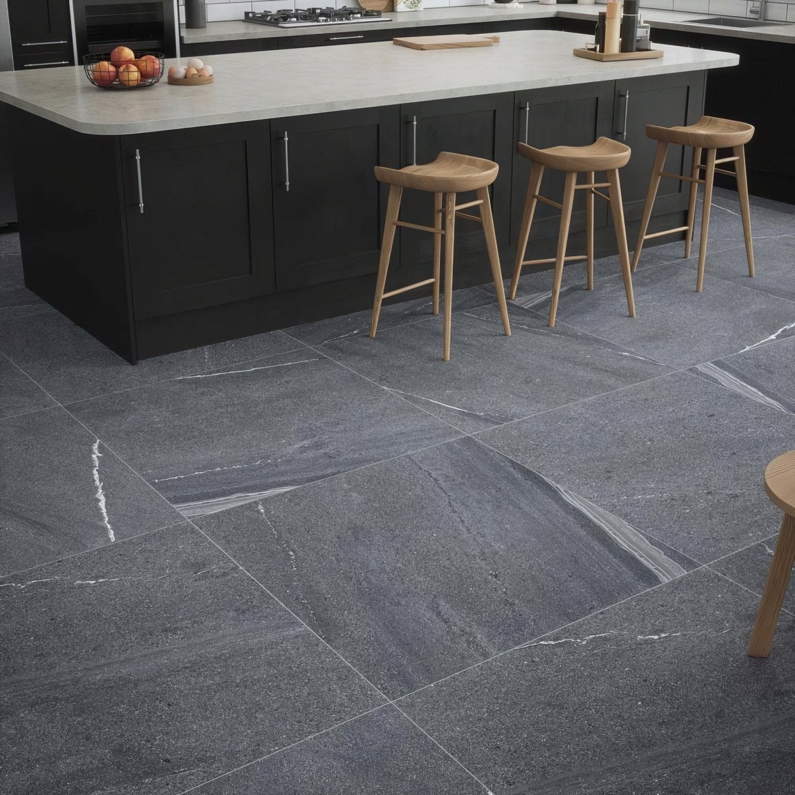 Dark gray stone tiles with white veining cover kitchen floor in eastford anthracite matt porcelain flooring
