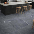 Dark gray stone tiles with white veining cover kitchen floor in eastford anthracite matt porcelain flooring