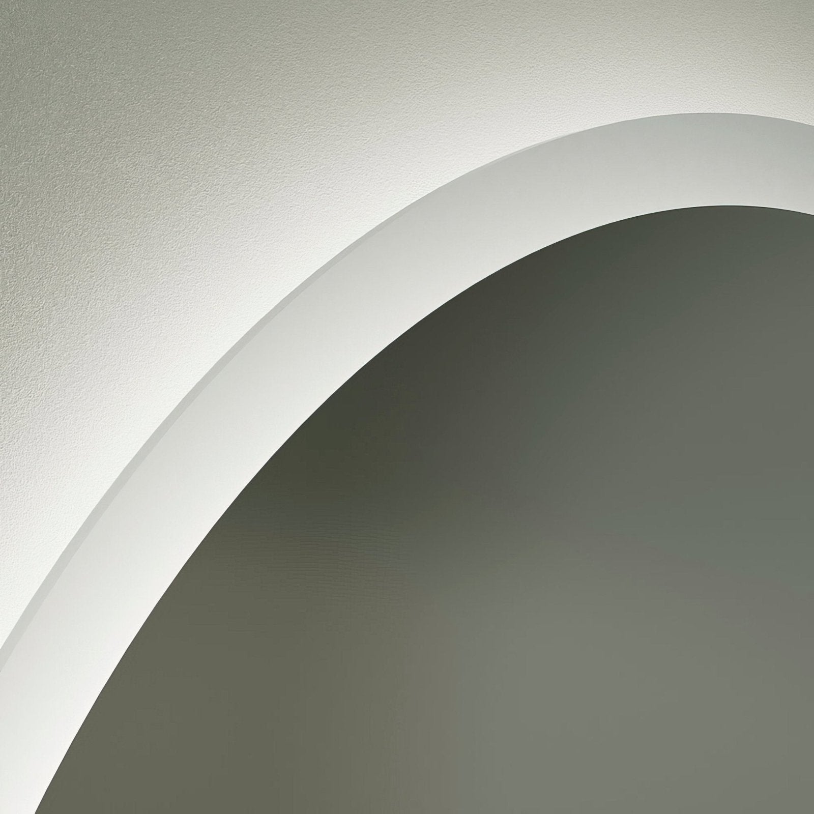 A sleek edison round mirror 120cm with minimalist white curved architectural molding and smooth finish