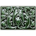 A glossy emerald green ceramic tile with raised relief art nouveau floral and leaf motifs edwardian acanthus caledonian