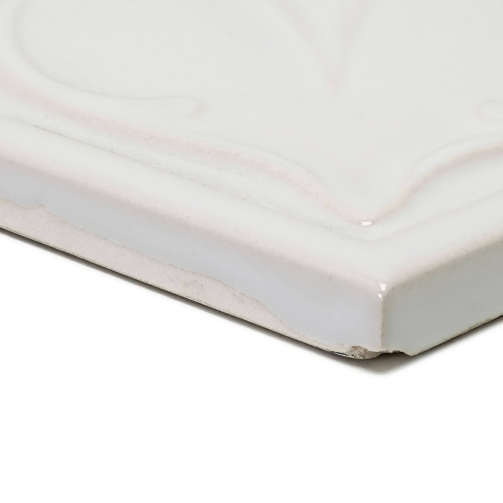 White ceramic tile edwardian acanthus highgate with subtle marbled veining and a glossy finish