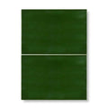 Two dark green edwardian caledonian base ceramic tiles with smooth glossy finish and subtle texture arranged vertically