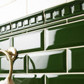 Edwardian green metro bevelled tile with deep green glossy ceramic and raised rectangular pattern on top border