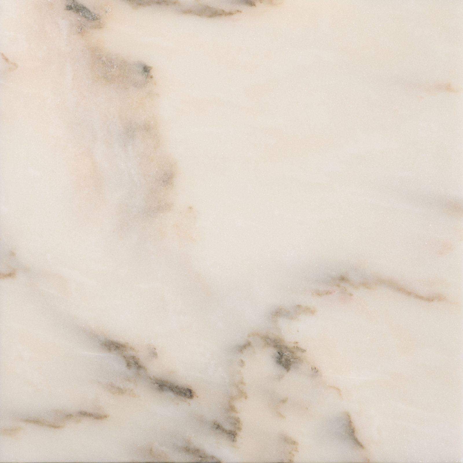 Cream-colored marble tile elixir marble cashmere honed with subtle gray veining and a honed finish