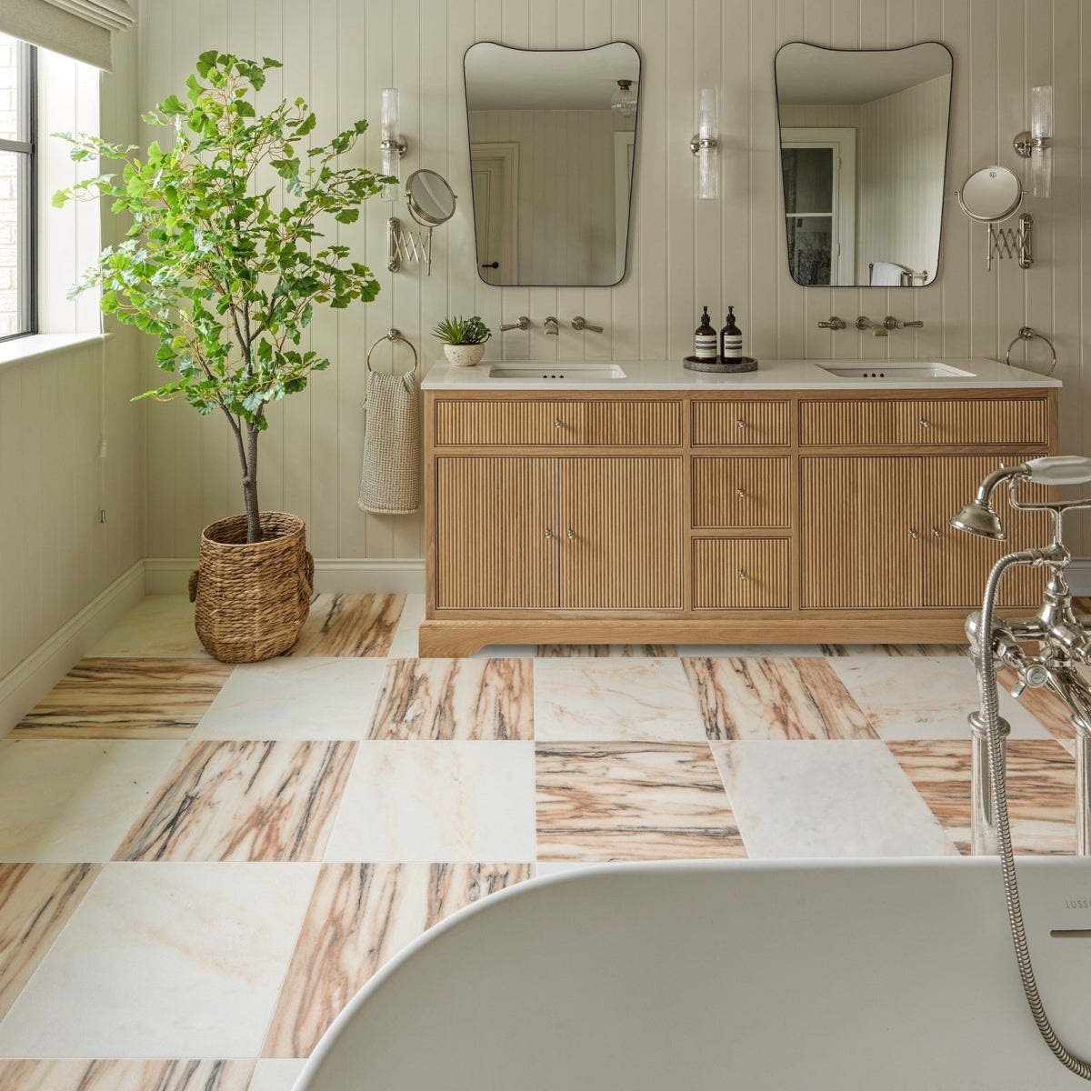 Elixir Marble Cashmere Honed in a bathroom setting