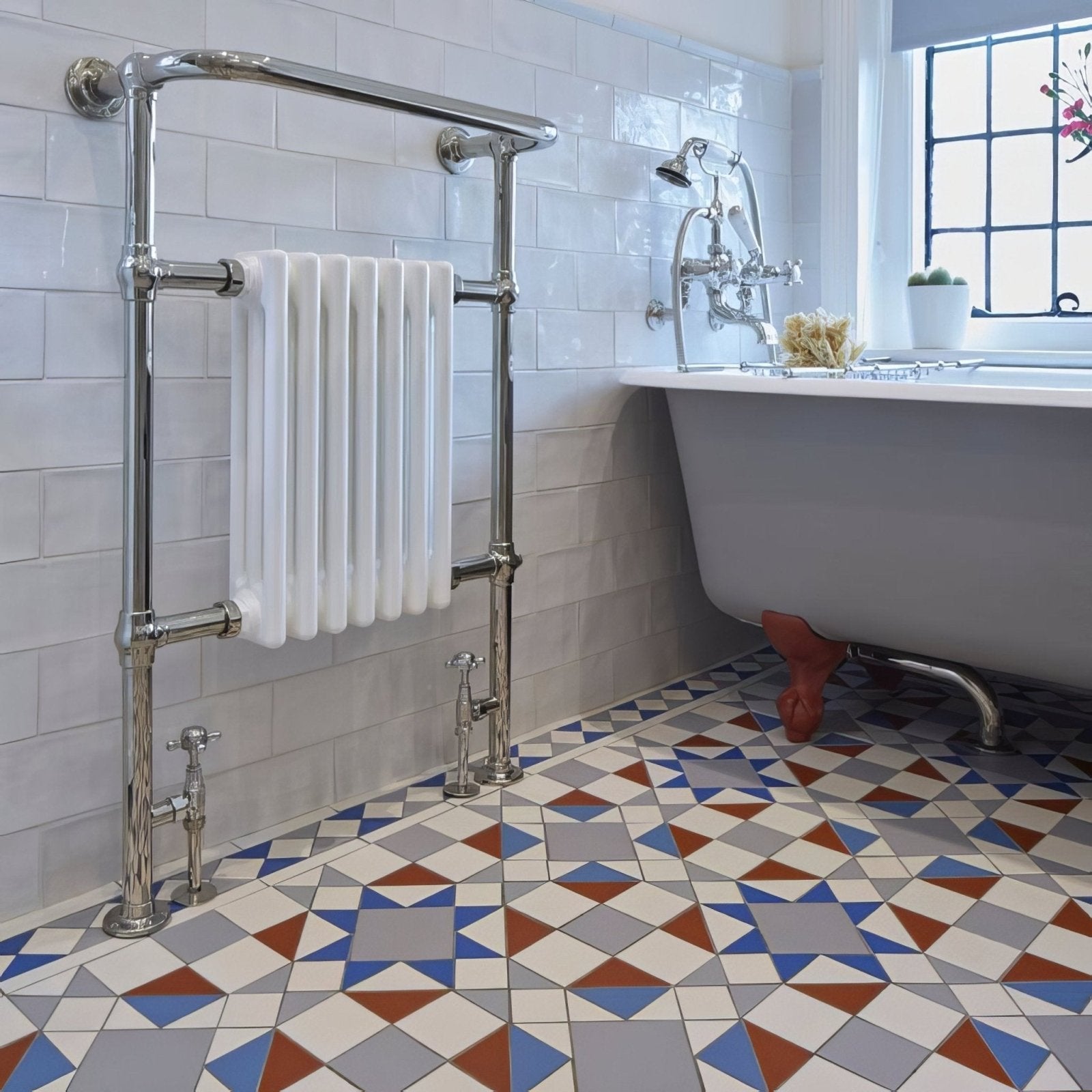 Chrome-finished eltham blue and red radiator with vertical fins and classic ornate design for home heating