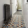 Antique-style dark gray cast iron radiator with ornate carved detailing from eltham blue and red collection