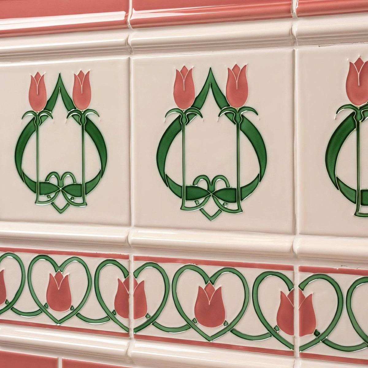 White ceramic elysée tiles in vintage white featuring pink tulips and green art nouveau foliage in a repeating pattern