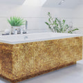 Emerald Gold 25mm Square gold mosaic on a bathtub with a white rim and chrome fixtures