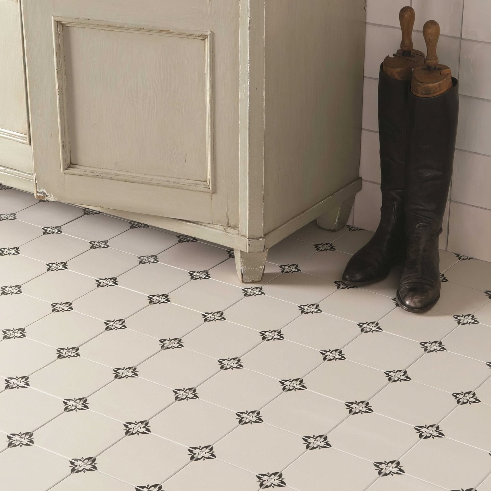 White square ceramic floor tiles empire black on dover white with black floral patterns arranged in a diamond grid