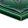 Deep emerald green empress beatrice malachite ceramic tile with glossy textured surface and raised floral relief design