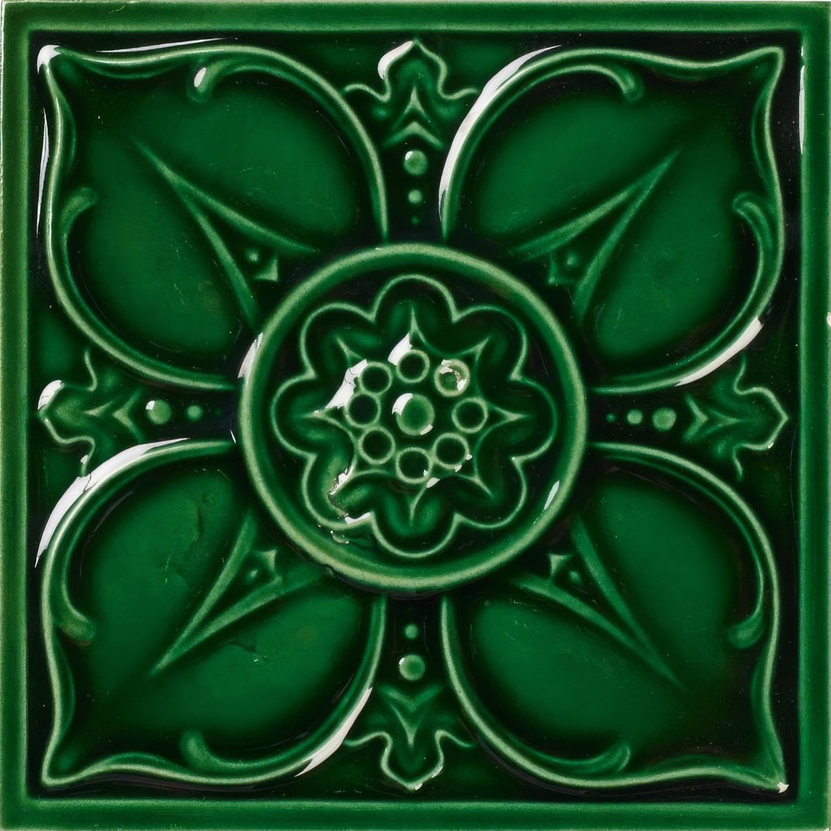 Deep emerald green ceramic empress beatrice malachite tile with raised floral relief design