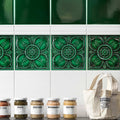 Deep emerald green ceramic empress beatrice malachite tiles with raised floral and leaf patterns