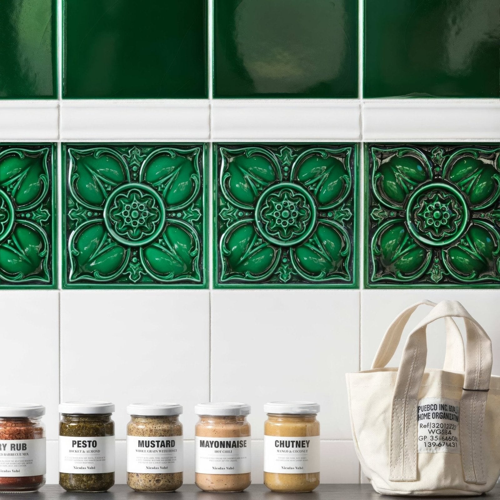 Green ceramic empress dado pearl tiles with raised floral and leaf patterns for decorative wall use