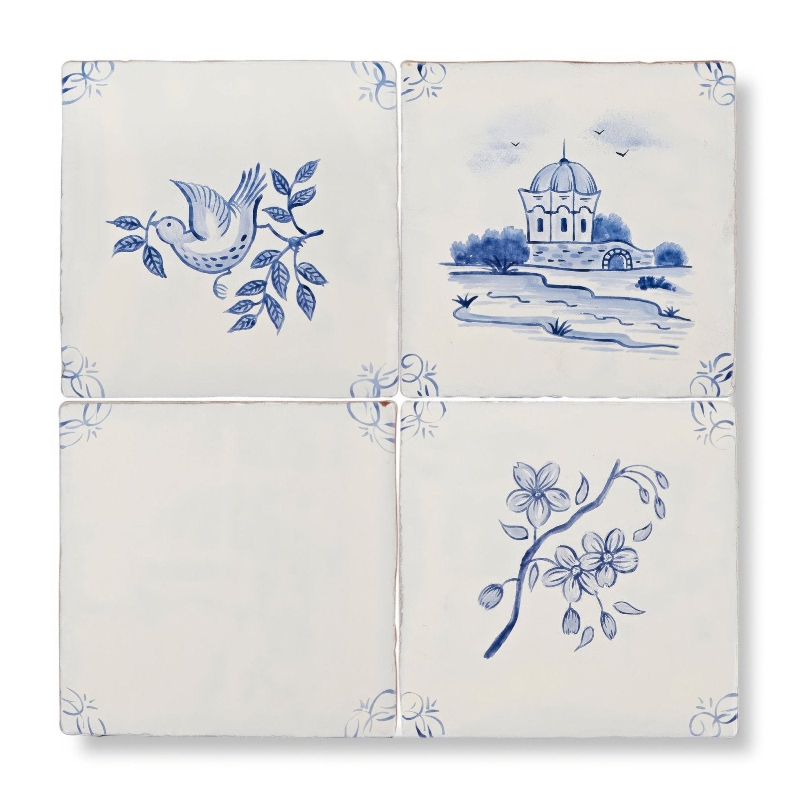 Set of four English delft blossom blue gloss ceramic tiles with hand-painted cobalt blue scenes on creamy white glaze