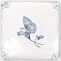 A square white ceramic english delft butterfly 2 blue gloss tile with a hand-painted blue butterfly and floral accents