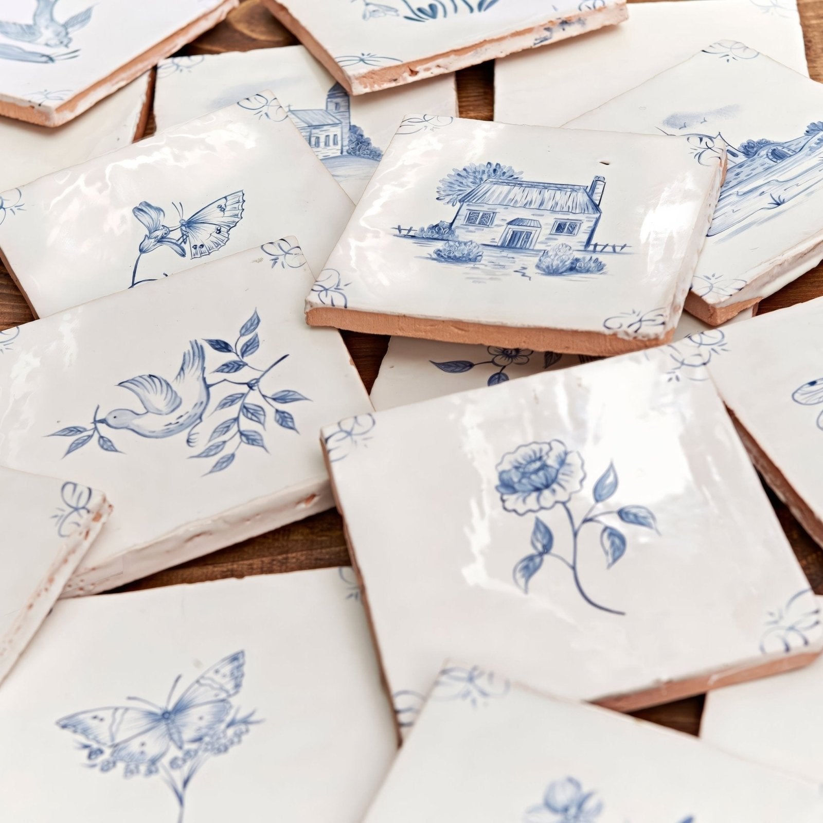 White ceramic english delft butterfly 2 blue gloss tile with delicate hand-painted birds butterflies flowers and houses