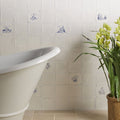 White ceramic english delft peony blue gloss tile with delicate blue hand-painted lighthouses churches and floral motifs