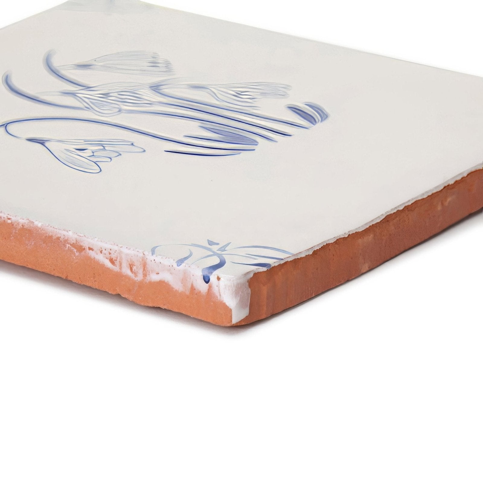 English Delft snowdrop blue gloss tile of white ceramic with blue floral design and terracotta edge