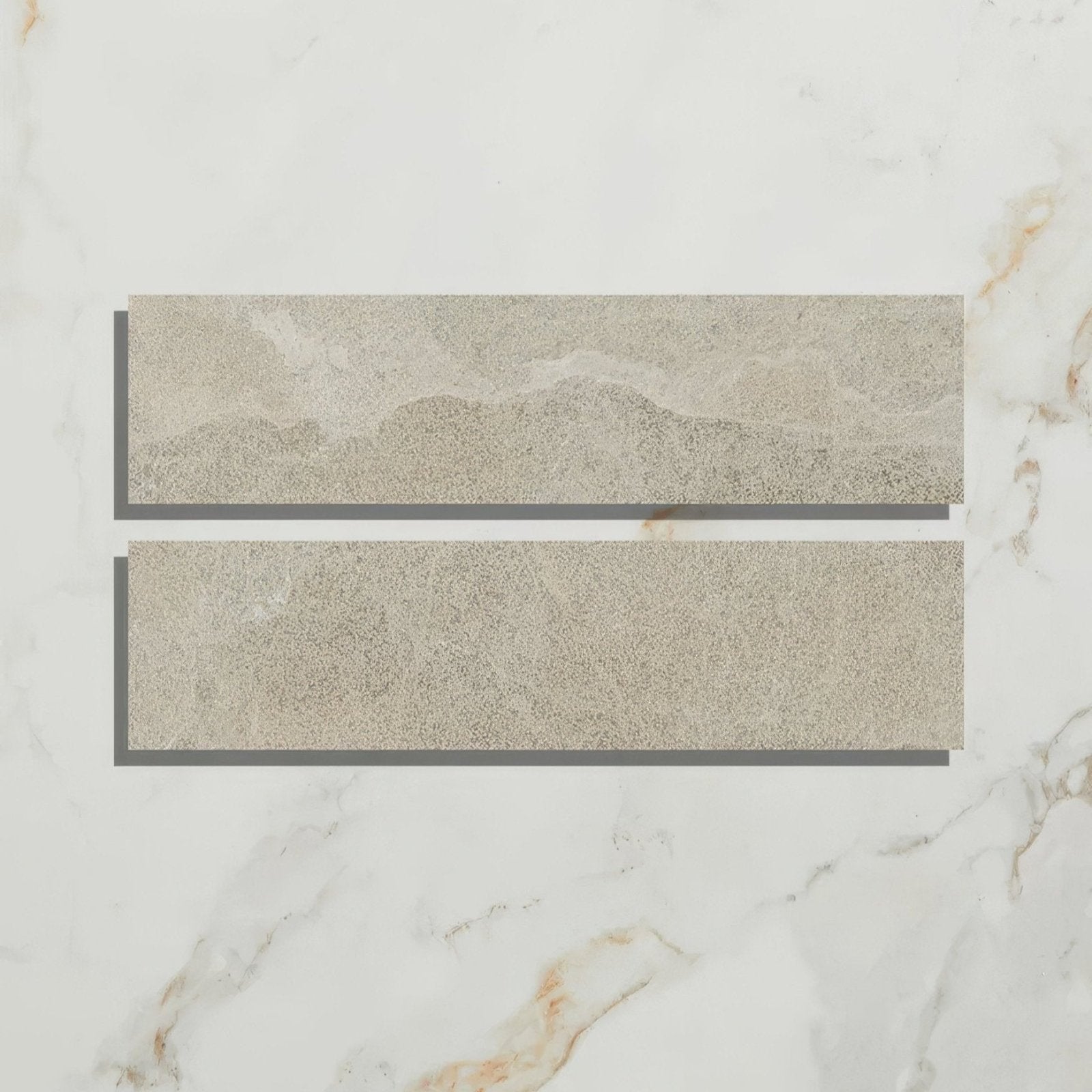 Two rectangular beige enki limestone parquet tiles with textured natural stone effect and velvet finish surface